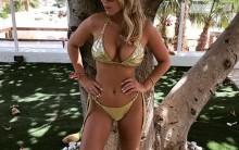 Kate Wright shows off eye-popping assets in sizzling cobalt two-piece.