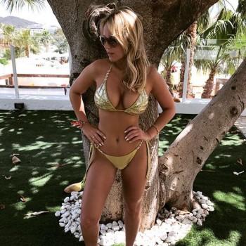 Kate Wright shows off eye-popping assets in sizzling cobalt two-piece.