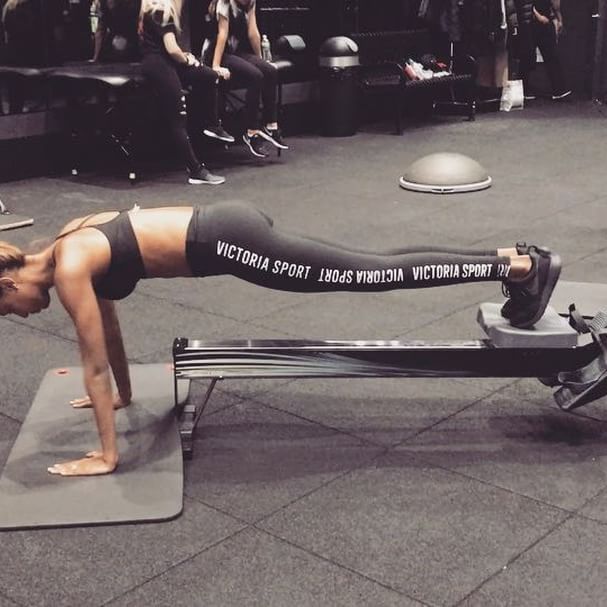 VS Angel Jasmine Tookes sports backless top with $55 Gymshark leggings for  LA workout