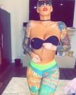 Model Amber Rose displays her assets donning a strapless backless bra in a racy video.