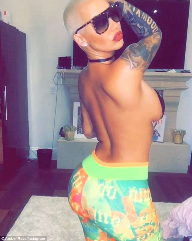 Amber Rose rubs her chest and shakes butt in a racy video. Amber Rose,Amber Rose bikini pics,Amber Rose bikini images,Amber Rose bikini stills,Amber Rose curves,Amber Rose curves pics,Amber Rose flaunts curves,Amber Rose curves pics,Amber Rose curves images,Amber Rose curves stills,Amber Rose curves pictures
