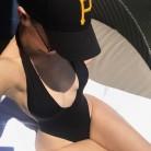 Australian Swimwear Designer Bianca Elouise puts on busty display in plunging black bikini.