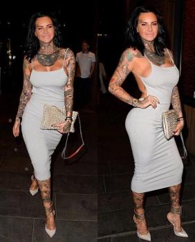 Jemma Lucy flaunts her ample assets in grey dress.