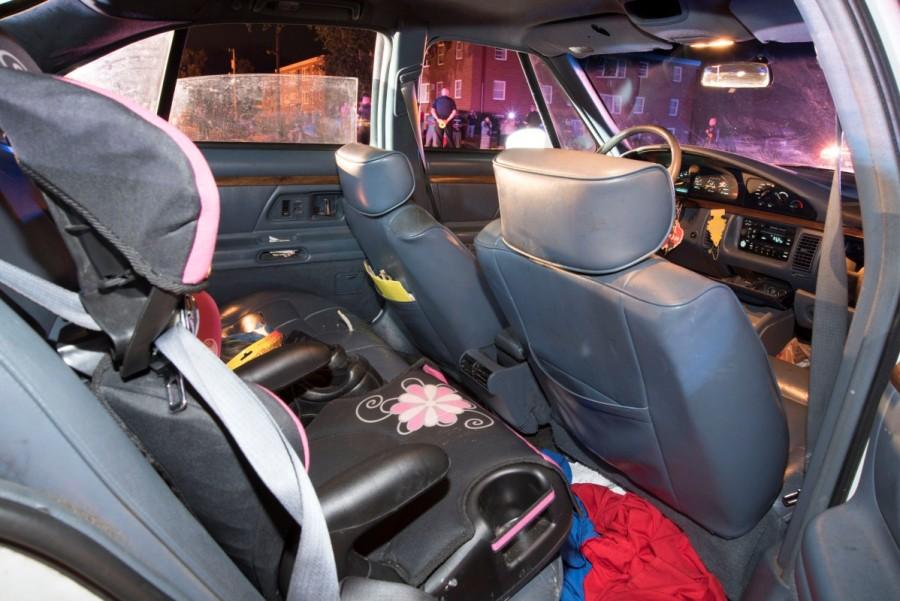 A child's car seat is seen at the rear of Philando Castile's car. Philando Castile shooting,Philando Castile,philando castile death,Philando Castiles girlfriend,Yanez fatally shot