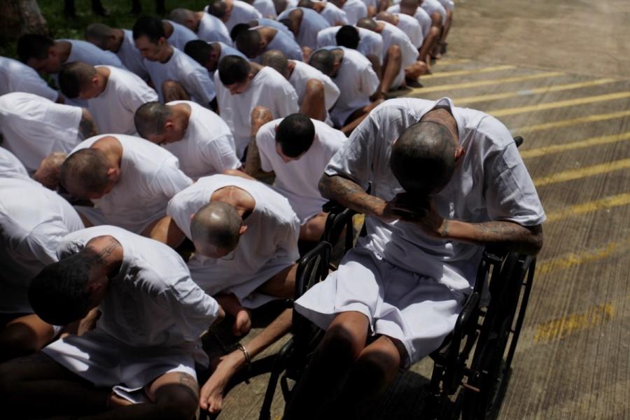 MS-13 gang members wait to be escorted upon their arrival at the maximum-security jail in Zacatecoluca, El Salvador. MS-13 gang,MS-13,MS-13 gang members,Members of MS-13,El Salvador,crime-ravaged,Central American nation