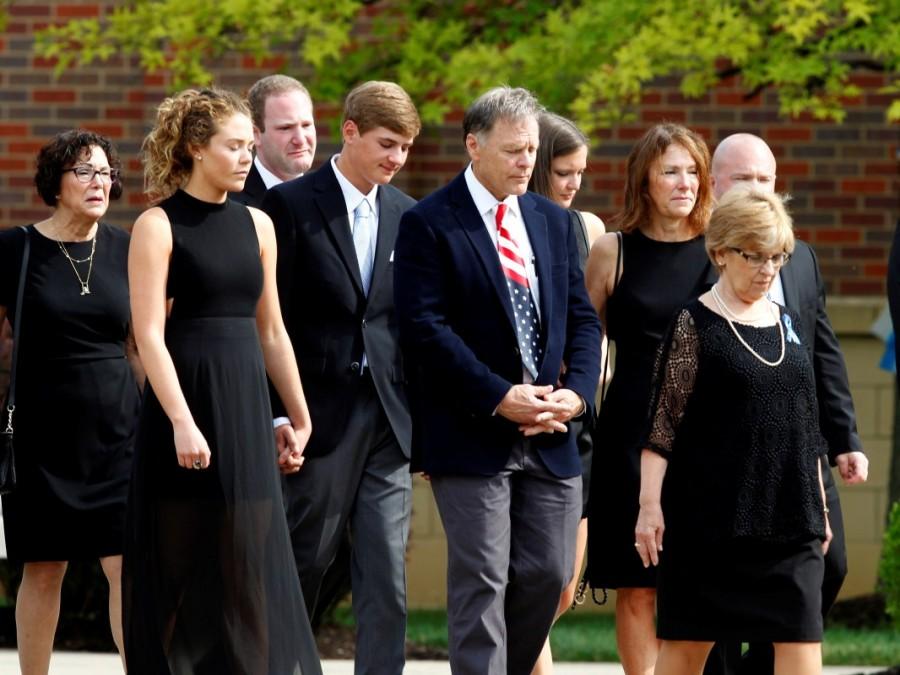 The family of Otto Warmbier follow his casket to the hearse after his funeral service at Wyoming High School in Wyoming, Ohio. Funeral for student,Funeral for student held prisoner,Otto Warmbier,United States