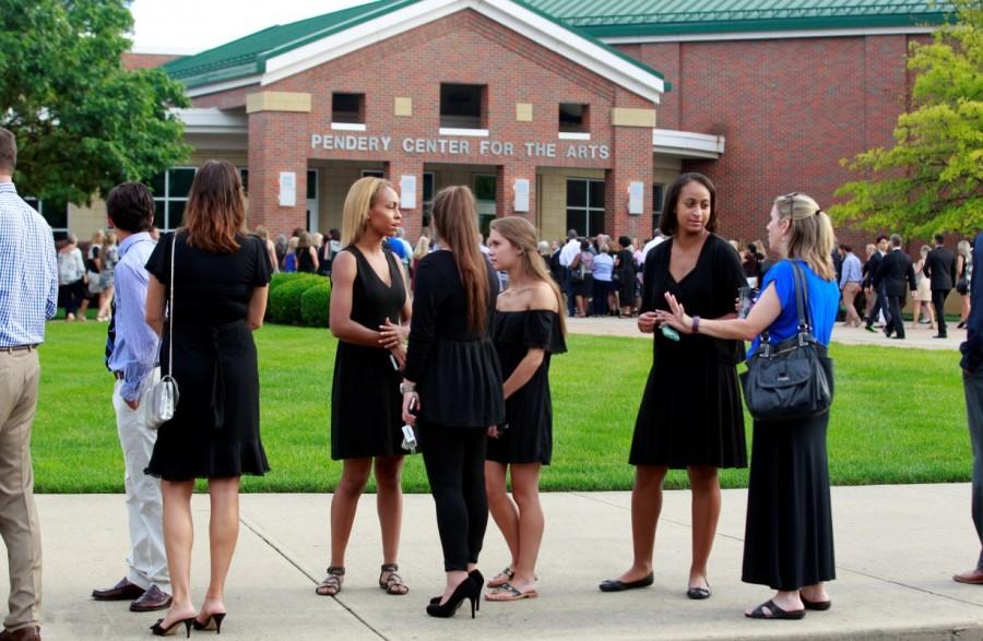 Mourners stand out side the art center before a funeral service for Otto Warmbier at Wyoming High School in Wyoming, Ohio. Funeral for student,Funeral for student held prisoner,Otto Warmbier,United States