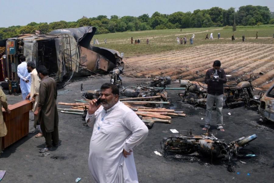 "The people of the area and passers-by had started gathering fuel when it exploded, burning everybody alive," provincial government spokesman Malik Muhammad Ahmed Khan said. An estimated 20 children were among the dead, The News International quoted Khan as saying. The police tried to clear the area before the tanker exploded but the people ignored them, Khan said. Pakistan tanker blast,tanker blast,Punjab province,Punjab,horrific oil tanker explosion,oil tanker explosion