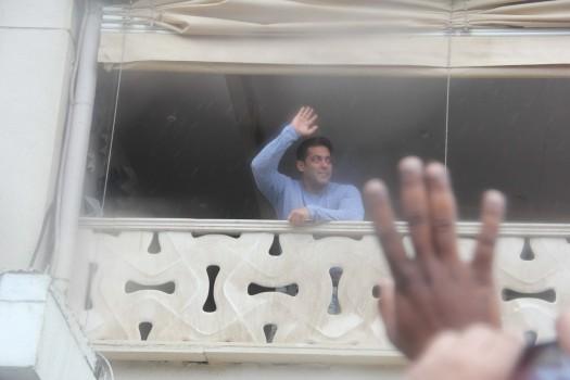 Salman Khan greets his fans outside Galaxy Apartments on the occasion of Eid.