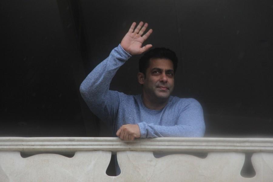 Bollywood actor Salman Khan greets his fans outside Galaxy Apartments on the occasion of Eid. Salman Khan,actor Salman Khan,Salman Khan greets fans outside,Eid Mubarak,Salman Khan wishes Eid Mubarak,salman khan at his residence