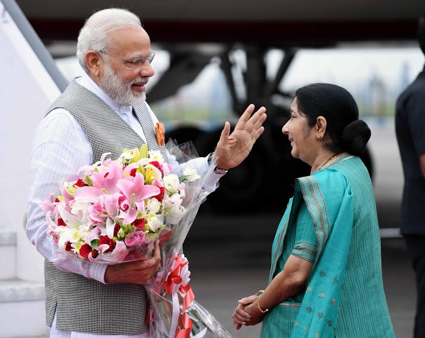 External Affairs Minister Sushma Swaraj received Modi at the Delhi airport. Narendra Modi,PM Narendra Modi,Narendra Modi returns to India,External Affairs Min Sushma Swaraj,Sushma Swaraj