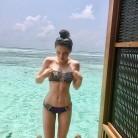 Kate Beckinsale's daughter Lily Beckinsale shows her cleavage in black bikini.