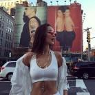 Bella Hadid puts on busty display in plunging white bikini