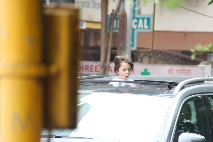 Bollywood actor Shah Rukh Khan's Son Abram Enjoying Open Car Ride On Mumbai Roads. AbRam Khan,Shahrukh Khan,Shahrukh Khan son,Shahrukh Khan son AbRam Khan,AbRam Khan car ride at Bandra,AbRam Khan car ride