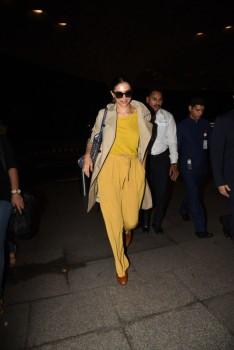 Bollywood actress Deepika Padukone spotted in bright yellow dress at airport.
