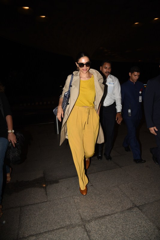 Bollywood actress Deepika Padukone spotted in bright yellow dress at airport. Deepika Padukone,actress Deepika Padukone,Deepika Padukone in yellow dress,Deepika Padukone at airport,Deepika Padukone airport pics,Deepika Padukone airport images,Deepika Padukone airport stills,Deepika Padukone airport pictures,Deepika Padukone airport