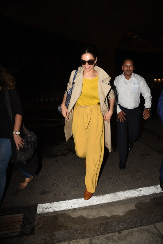 Deepika Padukone spotted in bright yellow dress at airport - Photos ...