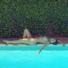 Model Nicole Scherzinger shows her cleavage in swimsuit.