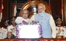 A minute after the stroke of midnight, President Pranab Mukherjee and Prime Minister Narendra Modi pressed the button to launch the new indirect tax regime on a digital screen with "GST" emblazoned on it in a golden hue. Conceived on the principle of 'one nation, one tax, one market', the tax that subsumes 17 central and state levies was launched in the presence of Vice President Hamid Ansari, former Prime Minister H.D. Deve Gowda, Lok Sabha Speaker Sumitra Mahajan, Finance Minister Arun Jaitley, MPs, chief ministers, state finance ministers, officials of the Centre and states. Notwithstanding the fact that the GST Law was a consensus product evolved over 14 years, the function in colorfully-decked Parliament House was boycotted by major opposition parties like Congress, Trinamool Congress, RJD, DMK and Left parties, saying the government was making a spectacle of a legislation for self-promotion, a charge Jaitley rejected. In keeping with his party's decision, former Primer Minister Manmohan Singh kept away from the event. However, MPs and leaders of Congress allies NCP and Samajwadi Party attended the function.