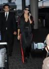 Kourtney Kardashian snapped in black and red tracksuit as she jets out of LAX.