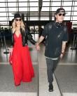 Paris Hilton and Chris Zylka are seen at LAX.