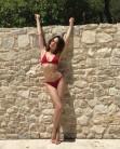 Olga Kurylenko exhibits her sensational curves in a skimpy red bikini.