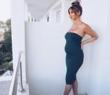 Ferne McCann showcases her blossoming stomach in bump.