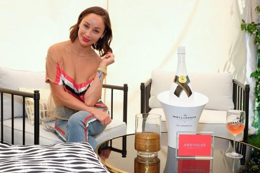 Cara Santana toasts to #REVOLVEintheHamptons with Moet & Chandon.