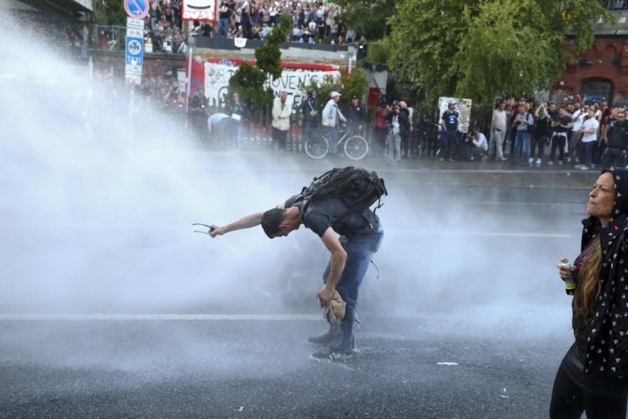German riot police use water cannons against protesters. G20 protests,G20,G20 protests Germany,clash in Germany,G20 summit