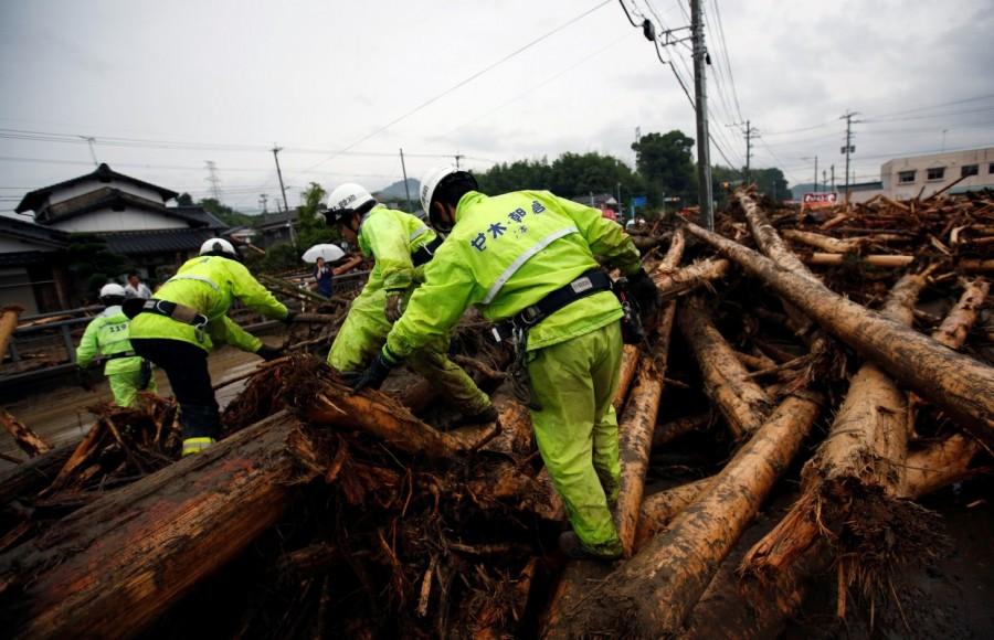 Firefighters conduct rescue operations in an area damaged by heavy rain in Asakura, Fukuoka Prefecture. Deadly deluge in Japan,Japan Deadly deluge,southwestern Japan,rains battered southwestern Japan,rain battered Japan,Torrential rain,Torrential rain in Japan