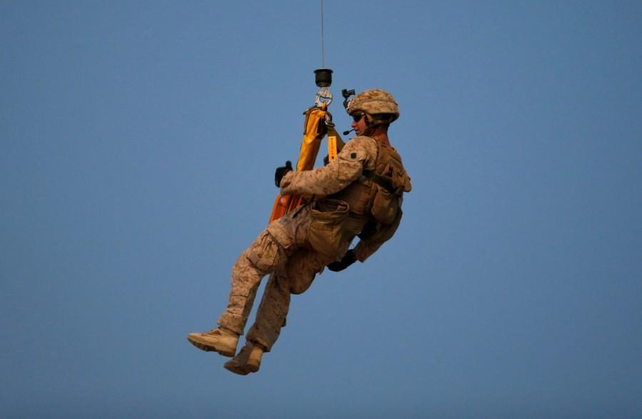 A U.S. Navy Corpsman takes part in a helicopter Medevac exercise. Afghan National Army,Afghan National,National Army,U.S. Marines,U.S. Marines train,Taliban insurgency