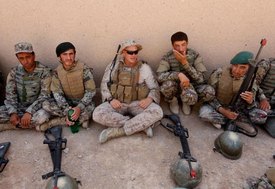 A U.S. Marine talks with Afghan National Army soldiers. Afghan National Army,Afghan National,National Army,U.S. Marines,U.S. Marines train,Taliban insurgency