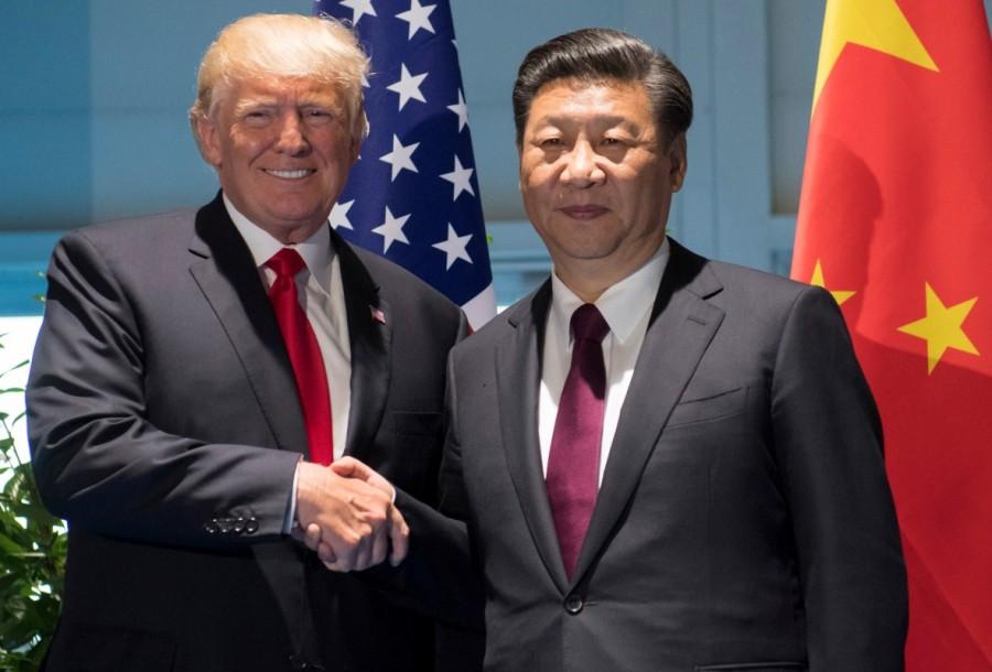 President Trump and Chinese President Xi Jinping shake hands prior to a meeting. G20 Summit,G20 summit 2017,G20 Summit pics,G20 Summit images,G20 Summit stills,G20 Summit pictures,Argentinia's President Juliana Awada,Argentinia's President Mauricio Macri,French President's wife Brigitte Macron,French President Emmanuel