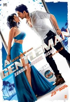 The new poster of 'A Gentleman - Sundar, Susheel, Risky' is out and it highlights the electrifying chemistry between its lead actors Sidharth Malhotra and Jacqueline Fernandez. Both Jacqueline and Sidharth are seen leaning towards each other trying to have a kiss in the new poster. The couple seems unfazed by to the distressing situations around them. Be it in the earlier poster where the duo were seen lip locking inside a car that was turning upside down, or the latest poster where a man seems to be stuck in a moving washing machine. Sidharth looks indeed the risky gentleman in the poster while Jacqueline is looking gorgeous in her blue sexy outfit. Sidharth and  Jacqueline share a sizzling chemistry in the film, and the trailer of the film which has been out recently is a proof to it and is surely going to leave an impact on its viewers.