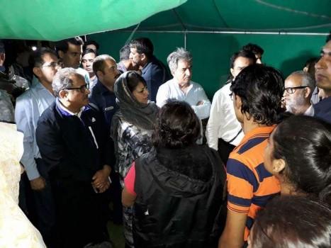 Chief Minister of Jammu and Kashmir Mehbooba Mufti with Deputy Chief Minister Nirmal Singh meeting the injured pilgrims in a hospital in Anantnag on July 10, 2017.