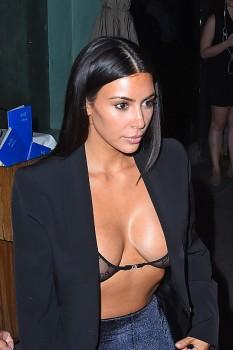 Model Kim Kardashian flaunts her assets in sheer Gucci lingerie NYC.