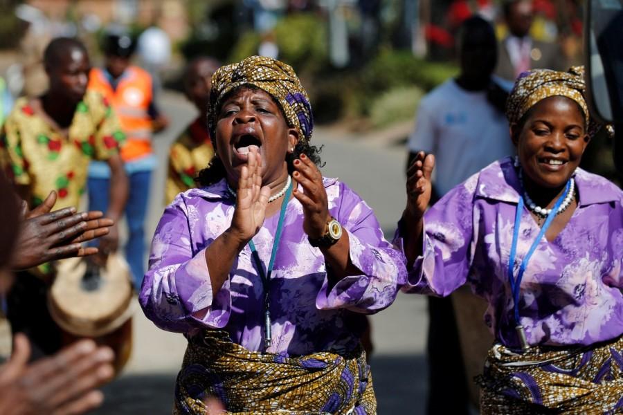 Women sing before the opening of the Mercy James hospital, a hospital named after one of Madonna's adopted child, Mercy James, in Blantyre, Malawi. Madonna,singer Madonna,Madonna sebastian,Madonna opens hospital wing,Madonna opens hospital,Malawi