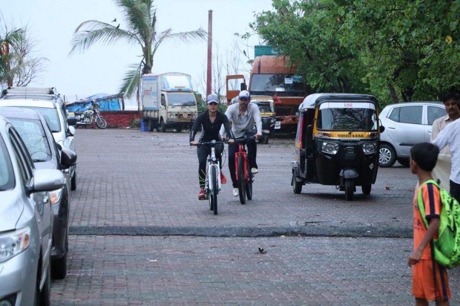 Film actress Rhea Chakraborthy with her friend riding cycle on the streets of Bandra. Rhea Chakraborthy,Rhea Chakraborthy riding cycle,Rhea Chakraborthy riding cycle in Bandra,Bandra,actress Rhea Chakraborthy