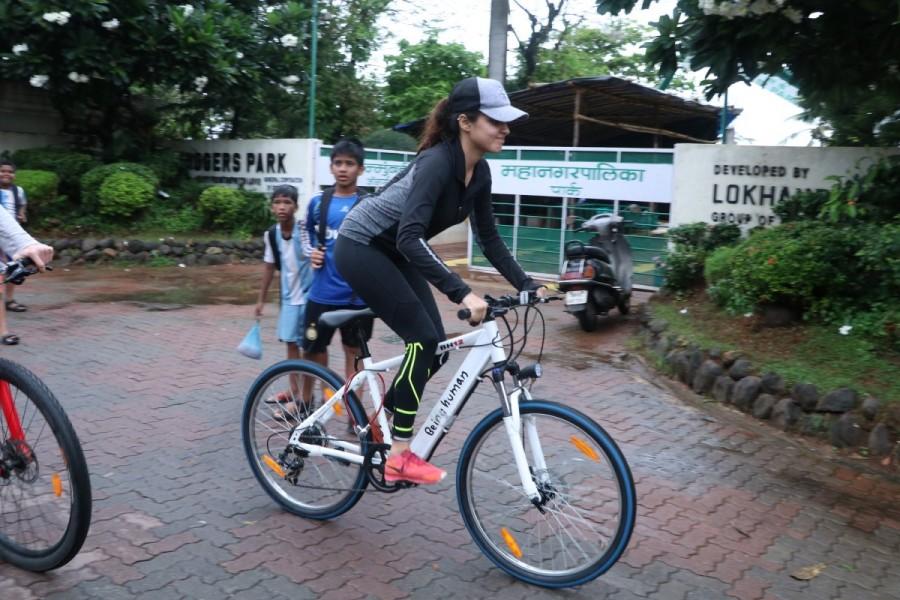 Bollywood film actress Rhea Chakraborthy with her friend riding cycle on the streets of Bandra. Rhea Chakraborthy,Rhea Chakraborthy riding cycle,Rhea Chakraborthy riding cycle in Bandra,Bandra,actress Rhea Chakraborthy