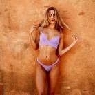 Model Kimberley Garner flaunts her toned figure in vibrant bikini.