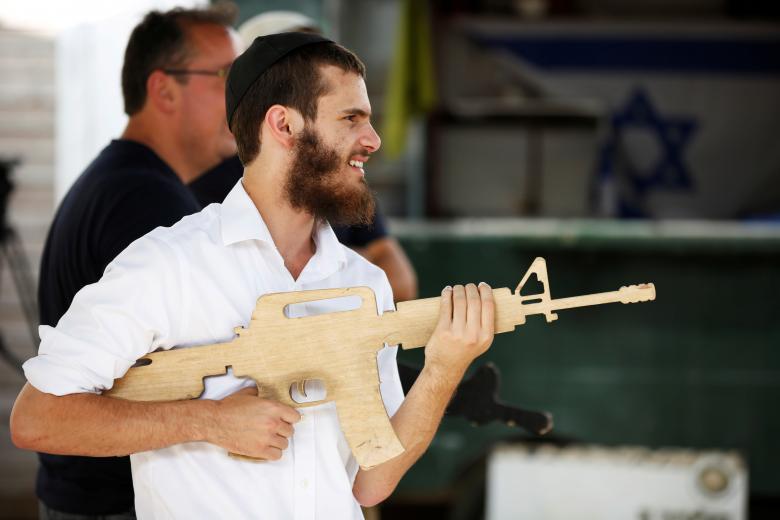 A tourist takes part in a two hour "boot camp" experience, at "Caliber 3 Israeli Counter Terror and Security Academy" in the Gush Etzion settlement bloc. Entrance to the gated compound in the Gush Etzion settlement bloc - built on land the Palestinians want for their own state - costs $115 for adults and $85 for children. Tourists train,counter-terrorism boot camp,terrorism boot camp,boot camp