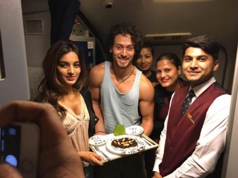 Tiger Shroff and debutant Nidhi Agarwal with cabin crew of a domestic airliner.