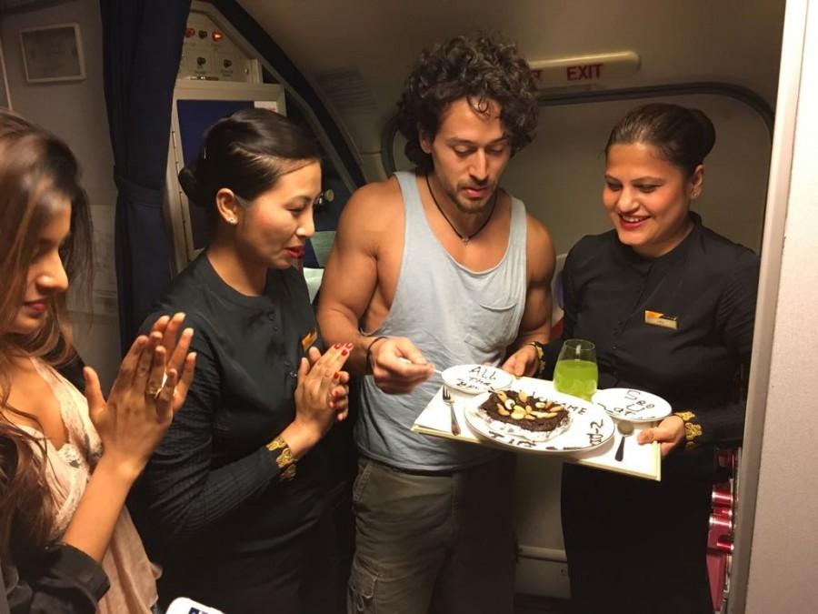 Actors Tiger Shroff and debutant Nidhi Agarwal with cabin crew of a domestic airliner. Tiger Shroff and Nidhi Agarwal,Tiger Shroff,Nidhi Agarwal,Munna Michael,Munna Michael actors