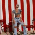 Isabella Khair Hadid looks stunning in plunging a crop top and ripped jeans during recent Europe trip.