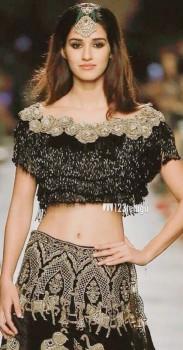 Young and vivacious Disha Patani added glamour to the Manav Gangwani's show at the India Couture Week (ICW) 2017 when she walked for the designer as a showstopper in black trousseau with 'maang tikka' adding drama to her looks. 