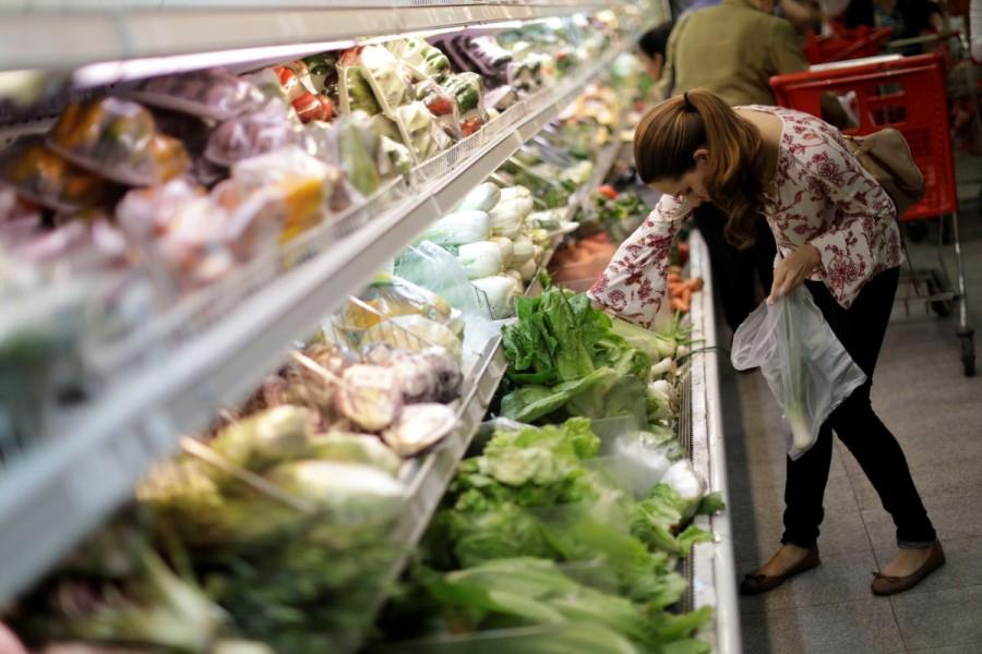 People buy food and other staple goods inside a supermarket in Caracas. Some fretted that they would not be able to find food and would lose money by being unable to work for two days. "People are desperate, there's a lot of tension. One of the checkouts collapsed due to all the pressure in the line," said housewife Patricia Vargas, 41, as she exited a supermarket. Venezuela,Stocking up before Venezuela,Venezuela strike