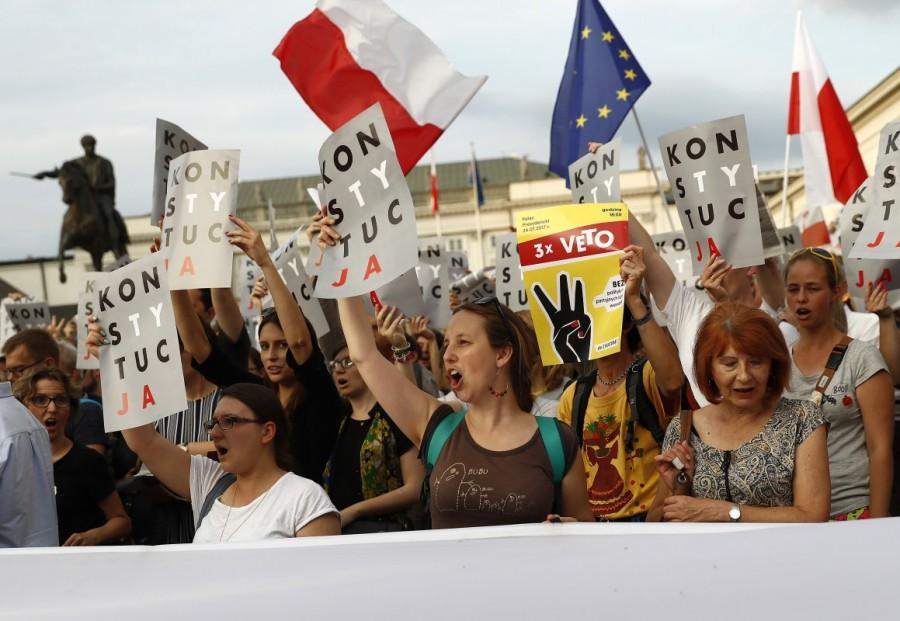 People attend a protest against judicial reforms in Warsaw, Poland. Polish court,Thousands protest Polish court,Supreme Court judges,European Union