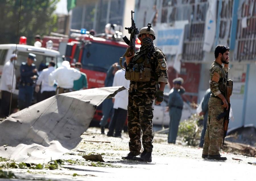 Afghan security forces keep watch at the site of a suicide attack in Kabul, Afghanistan. Taliban car bomb attack,car bomb attack,Kabul,Kabul car bomb attack,Kabul car bomb attack in Taliban,Taliban suicide attacker