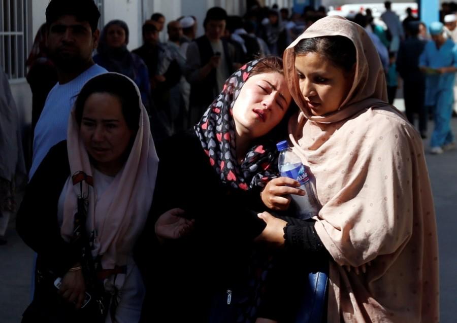 Afghan women mourn inside a hospital compound after a suicide attack in Kabul, Afghanistan. Taliban car bomb attack,car bomb attack,Kabul,Kabul car bomb attack,Kabul car bomb attack in Taliban,Taliban suicide attacker