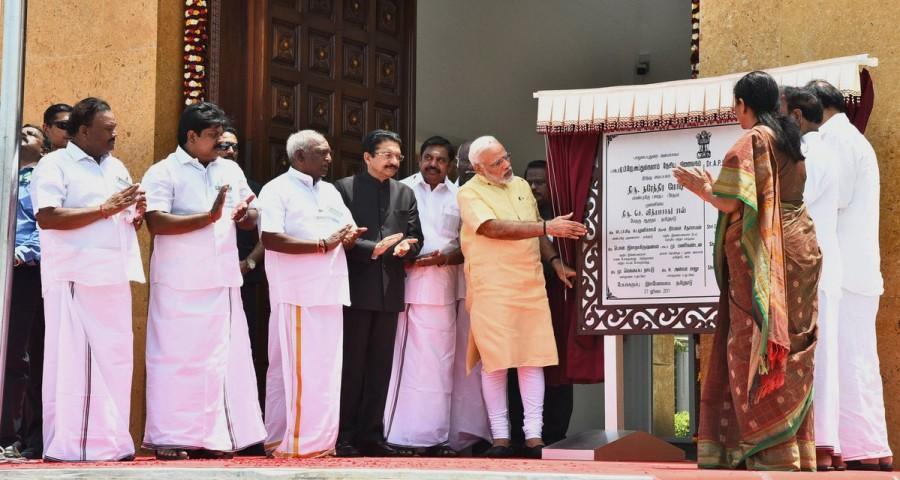 Prime Minister Narendra Modi on Thursday inaugurated former President A.P.J. Abdul Kalam's memorial in Tamil Nadu's Ramananthapuram district. Modi also flagged off 'Kalam Sandesh Vahini', an exhibition bus which would travel across various states and reach Rashtrapati Bhavan on October 15, the 86th birth anniversary of the former President. The memorial at Pei Karumbu was built by the Defence Research and Development Organisation (DRDO) at an outlay of around Rs 16 crore in a year's time. Prior to cutting the ribbon and entering the memorial, Modi hoisted the national flag at the site. Inside the memorial Modi also unveiled the veena playing Kalam's statue, offered floral tributes and interacted with the family members of the former President, who hailed from Rameswaram. Narendra Modi,Abdul Kalam,Abdul Kalam memorial,Abdul Kalam memorial in Rameswaram,former President A.P.J. Abdul Kalam,A.P.J. Abdul Kalam